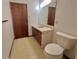 Bathroom featuring a decorative vanity, a mirror, and a toilet at 407 Paradise Island Dr, Haines City, FL 33844