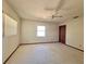 Bright bedroom with plush carpeting, ceiling fan and natural light from windows at 407 Paradise Island Dr, Haines City, FL 33844