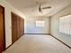Bright bedroom with plush carpeting, ceiling fan and natural light from windows at 407 Paradise Island Dr, Haines City, FL 33844