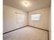 Bright bedroom with carpet, two windows with blinds, and a ceiling light at 407 Paradise Island Dr, Haines City, FL 33844