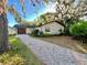 Single story home featuring a stone driveway and a garage at 407 Paradise Island Dr, Haines City, FL 33844