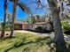 A single story home featuring an attached garage and a stone driveway at 407 Paradise Island Dr, Haines City, FL 33844