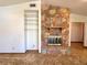 Living room fireplace with stone surround and built in shelving at 407 Paradise Island Dr, Haines City, FL 33844