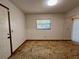 Bright living room with carpet floors featuring natural light from window with white blinds at 407 Paradise Island Dr, Haines City, FL 33844