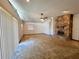 Bright living room featuring vaulted ceilings, stone fireplace, and ceiling fan at 407 Paradise Island Dr, Haines City, FL 33844