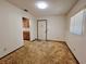 Living room with neutral walls, carpet flooring, and natural light from a window at 407 Paradise Island Dr, Haines City, FL 33844