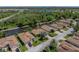 Aerial view of a home situated in a picturesque waterfront community with green trees and manicured lawns at 4168 Aberdeen Ln, Lake Wales, FL 33859