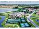 Overhead shot of community featuring golf course, lake, tennis courts and clubhouse at 4168 Aberdeen Ln, Lake Wales, FL 33859