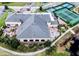 Aerial view of the clubhouse showing the hot tubs, patio, landscaping, and roof at 4168 Aberdeen Ln, Lake Wales, FL 33859