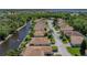 An aerial view shows a residential neighborhood with mature trees, and a lake nearby at 4168 Aberdeen Ln, Lake Wales, FL 33859