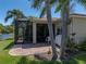 Relax on the beautiful brick back patio and enjoy the lush landscaping and serene lake views at 4168 Aberdeen Ln, Lake Wales, FL 33859