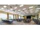Spacious banquet hall with ample seating, stage area, and large windows, ideal for hosting events and gatherings at 4168 Aberdeen Ln, Lake Wales, FL 33859