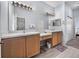 Double sink bathroom featuring updated fixtures, marble floors, and plenty of counter space at 4168 Aberdeen Ln, Lake Wales, FL 33859