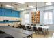 Spacious craft room featuring long tables, chairs, and ample storage for creative projects at 4168 Aberdeen Ln, Lake Wales, FL 33859