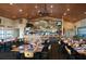 The dining room features a bar area, tables and chairs, and a ceiling with recessed lighting at 4168 Aberdeen Ln, Lake Wales, FL 33859