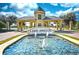 Grand entrance to Lake Ashton featuring a beautiful fountain and well-manicured landscaping at 4168 Aberdeen Ln, Lake Wales, FL 33859