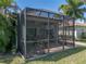 Rear exterior of the home showing a screened-in lanai at 4168 Aberdeen Ln, Lake Wales, FL 33859