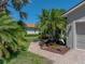 Charming single-story home with a brick walkway and lush tropical landscaping at 4168 Aberdeen Ln, Lake Wales, FL 33859