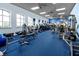 Well-equipped gym with treadmills, elliptical machines, weights, and floor-to-ceiling windows at 4168 Aberdeen Ln, Lake Wales, FL 33859