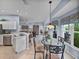 Open kitchen and breakfast nook feature natural light and a view of the landscaped backyard at 4168 Aberdeen Ln, Lake Wales, FL 33859