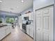 Kitchen view showcases stainless appliances, white cabinets, breakfast nook, and storage at 4168 Aberdeen Ln, Lake Wales, FL 33859