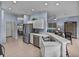 Bright kitchen with stainless steel appliances, white cabinetry, and open layout at 4168 Aberdeen Ln, Lake Wales, FL 33859