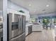 Open kitchen design with stainless appliances, white cabinetry, and breakfast nook at 4168 Aberdeen Ln, Lake Wales, FL 33859