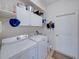 Bright laundry room with white cabinets, washer and dryer, and plenty of storage at 4168 Aberdeen Ln, Lake Wales, FL 33859