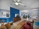 Open living space with living room, dining area, and kitchen featuring tiled floor and light blue walls at 4168 Aberdeen Ln, Lake Wales, FL 33859