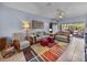 Inviting living room with plush sofas, colorful rug, and access to the lanai at 4168 Aberdeen Ln, Lake Wales, FL 33859