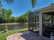 Screened-in lanai offering water views and comfortable seating at 4168 Aberdeen Ln, Lake Wales, FL 33859