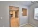 View into the kitchen featuring tiled floors, cabinets, and modern appliances at 4174 Pirates Lndg, Winter Haven, FL 33884