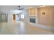 Open living area with tile floors, a fireplace, and a view towards the entryway at 4174 Pirates Lndg, Winter Haven, FL 33884