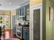 Cozy kitchen featuring stainless steel appliances and a walk-in pantry at 4485 Turnberry Ln, Lake Wales, FL 33859