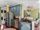 Open-concept kitchen featuring stainless steel appliances and a breakfast bar with seating at 4485 Turnberry Ln, Lake Wales, FL 33859