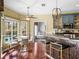 Well-lit breakfast nook with hardwood floors, pool view, and eat-in kitchen at 4485 Turnberry Ln, Lake Wales, FL 33859