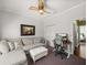 Bright office features a comfortable sofa, ottoman, and office setup with monitor at 4485 Turnberry Ln, Lake Wales, FL 33859