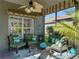 Comfortable seating area with cozy cushions and pillows in a relaxing screened-in lanai at 4485 Turnberry Ln, Lake Wales, FL 33859