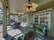 Enjoy the outdoor living space on this patio, complete with a ceiling fan, comfortable seating, and views of the pool and backyard at 4485 Turnberry Ln, Lake Wales, FL 33859