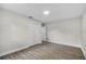 Bright bedroom features wood-look floors, closet, and neutral paint at 4615 Reynosa Sw Dr, Winter Haven, FL 33880