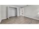 Bedroom featuring a closet, a window allowing for natural light and vinyl wood flooring at 4615 Reynosa Sw Dr, Winter Haven, FL 33880