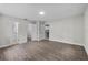 Bedroom with wood-look floors, three doors and neutral paint at 4615 Reynosa Sw Dr, Winter Haven, FL 33880