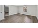 Bedroom features wood-look floors and neutral paint at 4615 Reynosa Sw Dr, Winter Haven, FL 33880