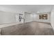 Open living room showcasing wood flooring and natural light from surrounding rooms at 4615 Reynosa Sw Dr, Winter Haven, FL 33880