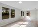 Sunlit living room boasts tile floors and large windows at 4615 Reynosa Sw Dr, Winter Haven, FL 33880