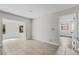 Open living room showcases tile flooring and natural light from two windows at 4615 Reynosa Sw Dr, Winter Haven, FL 33880
