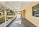 Covered screened-in patio with view of the backyard, perfect for outdoor relaxation at 4615 Reynosa Sw Dr, Winter Haven, FL 33880