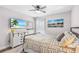 Bedroom featuring soft lighting, patterned bedding and art creating a restful ambiance at 462 Lake View Way, Auburndale, FL 33823