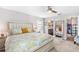 Spacious bedroom with a king bed, ensuite bathroom, and large mirror at 462 Lake View Way, Auburndale, FL 33823