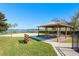 Community area with a picnic gazebo and basketball court overlooking a peaceful lake at 462 Lake View Way, Auburndale, FL 33823